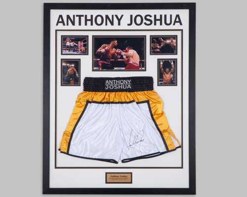 Anthony Joshua autographed white, black and gold boxing shorts display