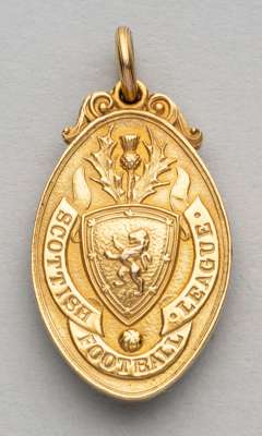 Scottish Football League winner's medal awarded to Motherwell's J Taggart, Director, 1931-32,
 obverse with Scottish crest and SCOTTISH FOOTBALL LEAGU