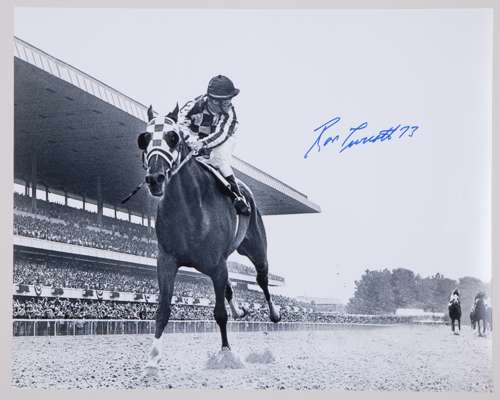 Black & white photo of Triple Crown winner Secretariat signed by jockey Ron Turcotte