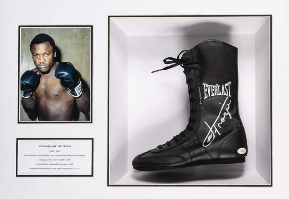 Joseph William 'Joe' Frazier signed left boot mounted in a display case,
 the Everlast 'Choice of champions' black leather right boot signed with silv