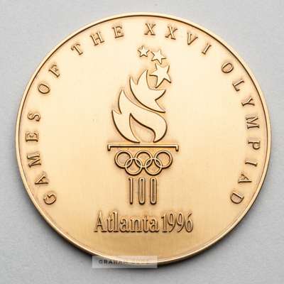 Atlanta 1996 Olympic Games participant's medal,
 designed by M. Grear, bronze, obverse with official torch logo with Olympic rings and legend GAMES OF