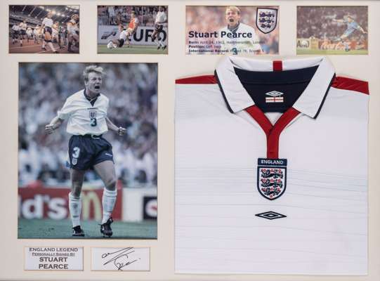 Stuart Pearce signed England display,
 comprising white England retro jersey embroidered with national three lion emblem and Umbro logo, mounted with 