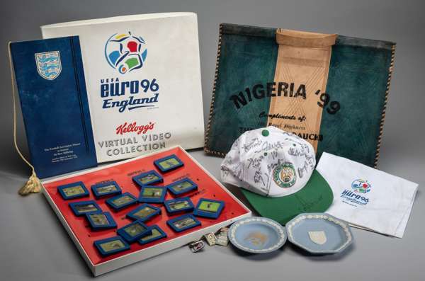 A box of various football memorabilia and ephemera, 
 including Euro 96 Kellogg's Virtual Video Collection, Euro 96 head rest covers, Wedgwood dishes,