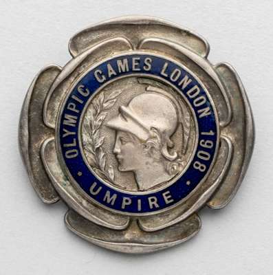 London 1908 Olympic Games Umpire badge,
 the silvered bronze badge featuring the head of Athena surrounded by OLYMPIC GAMES LONDON 1908 UMPIRE in a bl