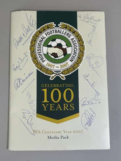 An autographed PFA 100 Years Anniversary media pack 
 the front cover bearing numerous autographs including Roger Hunt, Ian Rush and a Cholmondeley C.