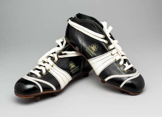 An early pair of PUMA 'Junior' football boots 1950s,
 German, adult size 43 stamped on the leather sole of each boot, unworn, in almost perfect condit