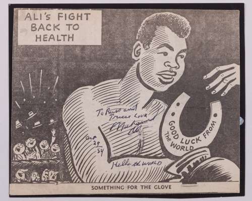 A dedicated and autographed Muhammad Ali signed newspaper cartoon cutting