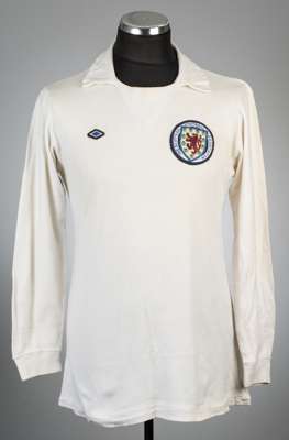 White Scotland no.9 change jersey, circa 1973-74,
 Umbro, long-sleeved with embroidered national emblem and blue diamond Umbro emblem, reverse numbere