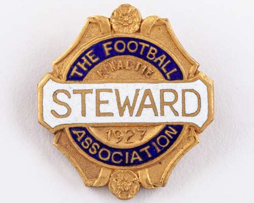 A gilt-metal and enamel Arsenal v. Cardiff City Football Association steward's badge, 1927