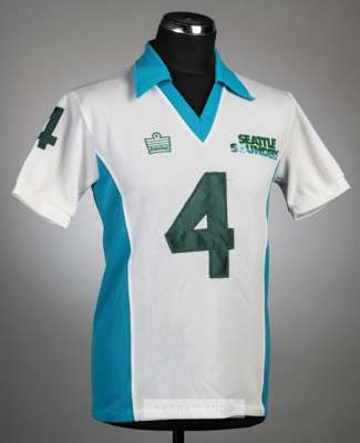 Alan Hudson white and light blue Seattle Sounders no.4 home jersey, NASL season 1980-82,
 Admiral, short-sleeved with SEATTLE SOUNDERS printed crest a