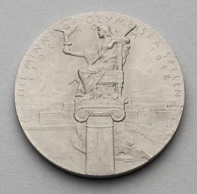 Stockholm 1912 Olympic Games participation medal, designed by Erik Lindberg,
 white metal, obverse with Zeus seated on an Ionian column holding the fi