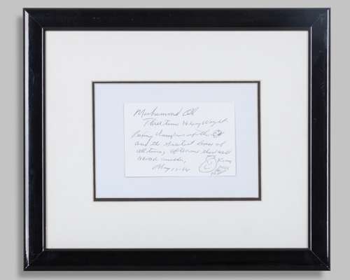 A Muhammad Ali handwritten, autographed and illustrated card, 1984