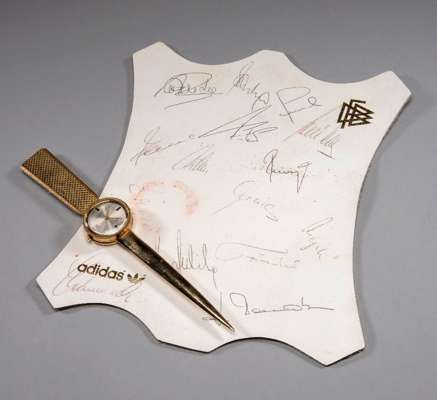 West Germany 1982 World Cup autographs, 15 squad signatures on an Adidas DFB leather mat; sold together with a 1982 World Cup commemorative pen knife/