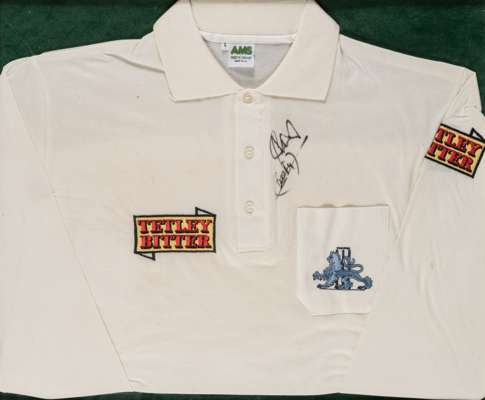 Ian Botham signed England Tetley Bitter player-issued cricket shirt, 
 AMS, white shirt embroidered with Tetley Bitter sponsor logo's and blue lion co