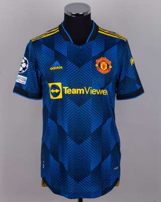 Luke Shaw blue and black No.23 Manchester United v. Atletico Madrid short-sleeved shirt, 2022