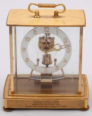 Bobby Moore a Kundo brass-cased electric mantel clock