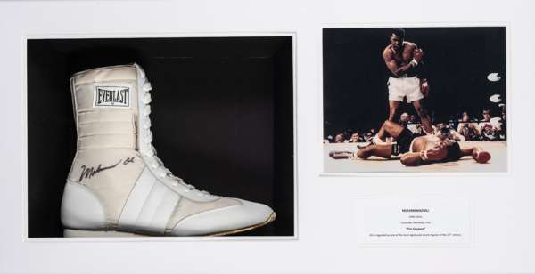 Muhammad Ali signed right boxing boot mounted in a display case,
 the Everlast 'Choice of champions' cream canvas and white leather right boot signed 