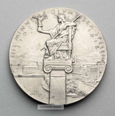 Stockholm 1912 Olympic Games participant's medal,
 designed by E Lindberg & Bertram Mackennal, in white metal, obverse with a victorious athlete in a 
