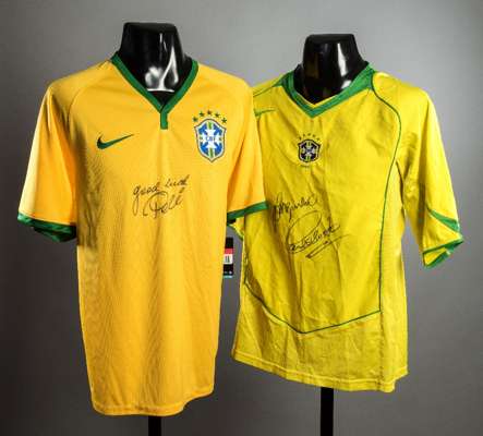 A duo of Brazil 5-star replica jerseys bearing the signatures of the 1970 World Cup winners Pele, Jairzinho & Carlos Alberto, the first signed by Pele