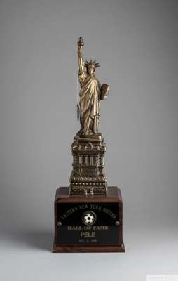 A trophy presented to Pelé when he was inducted into the Eastern New York Soccer Hall of Fame
 on December 8, 1996. The trophy consists of a brass dep