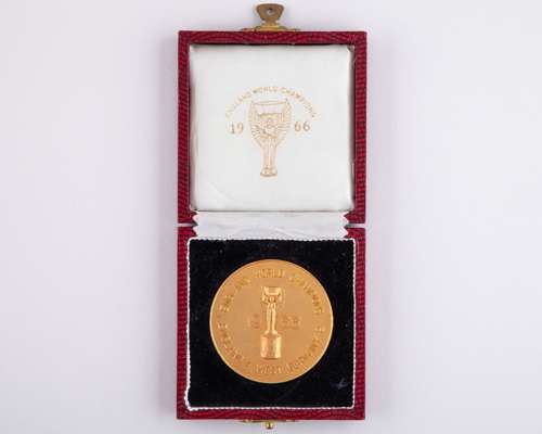 A 1966 yellow-metal commemorative medallion