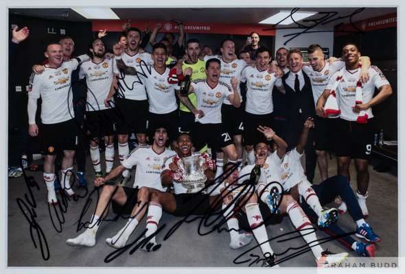 Two colour Manchester United partially autographed photographs
 taken in the dressing room after the 2016 F.A.Cup final win and 2016-17 League Cup win