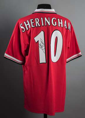 Teddy Sheringham signed Manchester United treble-winning style replica home jersey, signed to the reverse No.10 in black marker pen