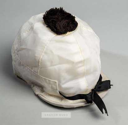 Jockey cap movie prop from the 2003 Hollywood movie 'Seabiscuit',
 the white cap with black bow above the peak with black pommel, the interior embroid