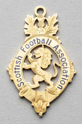 Scottish Football Association Cup winner's medal awarded to Rangers' trainer A Dixon, 1933-34,
 obverse with blue enamelled lettering SCOTTISH FOOTBAL