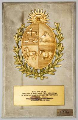 Uruguayan Football Association plaque presented to the Football Association at the 1966 World Cup,
 bearing the Coat of Arms of Uruguay in gilt-metal 