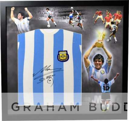 Diego Maradona signed and framed Argentina 1986 World Cup winners retro shirt, 
 frame measures 33 x 33in., comes complete with COA and photograph pro
