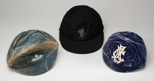 A trio of sporting caps 
 a Victorian Honours cap embroidered "AFC" made by Gulland & Kennedy of Edinburgh, a Varsity Rubber peak cap c.1920's and a l