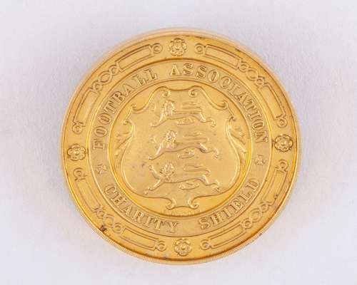 Joseph Dines a yellow-metal Charity Shield medal