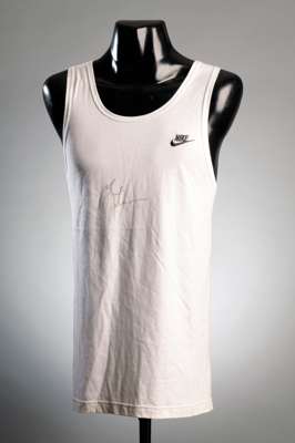 Michael Johnson signed white Nike running vest, signature in black marker pen