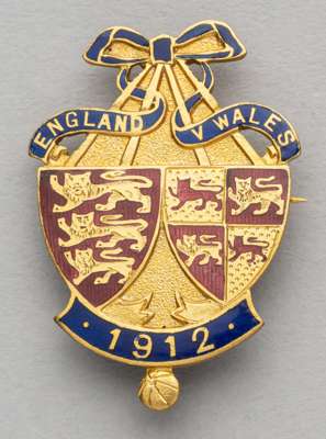 England v Wales enamelled lapel badge for the Home International Championship, played at Wrexham, 11th March 1912,
 obverse enamelled with England and