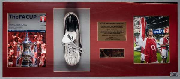 Robert Pires signed football boot display commemorating the F.A. Cup final win v Southampton, played at Millennium Stadium, 17th May 2003,
 featuring 