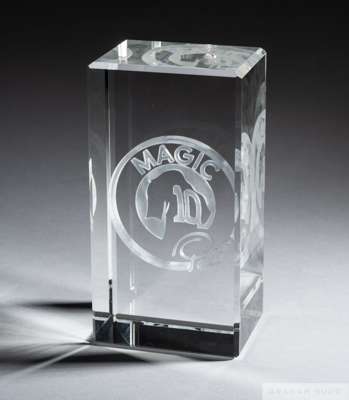 A trophy presented to Pelé composed of a large crystal block with an internal laser-etched image of Pelé's #10 jersey, integrated into the phrase "Mag