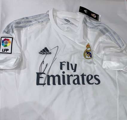 Real Madrid's Cristiano Ronaldo hand signed replica jersey (2015/16),
 with exact photo proof of signing and COA