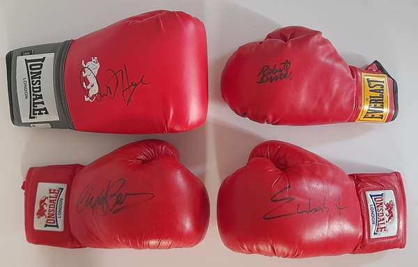 Boxing Legends, four gloves signed by Robert “Mano de Piedra” Duran, Nigel “The Dark Destroyer” Benn, David “The Hayemaker” Haye and Chris “Next Gen” 