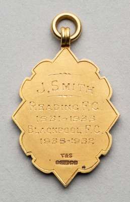 The Football League Long Service medal awarded to Reading F.C. and Blackpool F.C.'s J. Smith, 1931-52,
 obverse with football in relief flanked by THE