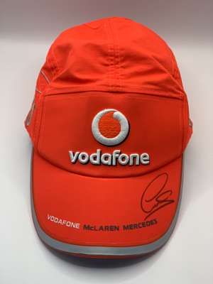 Lewis Hamilton (UK) signed Vodafone McLaren-Mercedes silver cap,
 signed in black permanent marker on peak. Hamilton achieved his first F1 World Champ