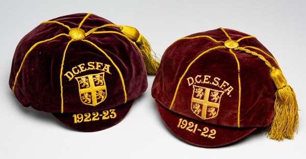 A pair of Durham County Elementary Schools' Football Association representative caps dated 1921-22 and 1922-23,
 maroon velvet caps, both embroidered 