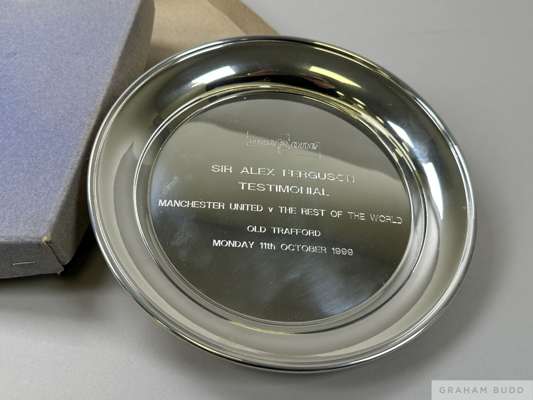 A pewter Sir Alex Ferguson Testimonial salver
 inscribed one 2 one, Sir Alex Ferguson Testimonial, Manchester United v. Rest of the World, Old Traffor