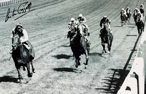 Two Lester Piggott signed horse racing b&w photographs,
 the first featuring Lester Piggott after winning his first Epsom Derby on 'Never Say Die' in 
