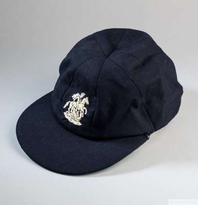 David Lloyd cap, for the MCC Tour to Australia and New Zealand 1974-75
 navy blue wool with embroidered George & the Dragon crest with interior label 