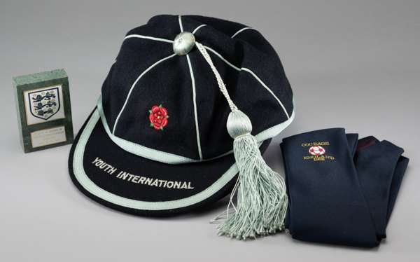 England Youth International football cap, 
 the blue cap with red rose emblem and inscribed YOUTH INTERNATIONAL, undated and recipient unknown and a n