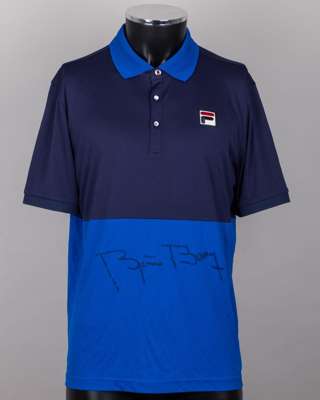 A blue Fila tennis shirt autographed by Bjorn Borg