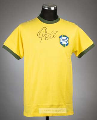 Pele signed yellow Brazil retro jersey,
 with national emblem badge, signed in black marker pen