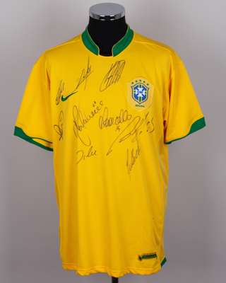 A yellow and green Brazil replica autographed shirt