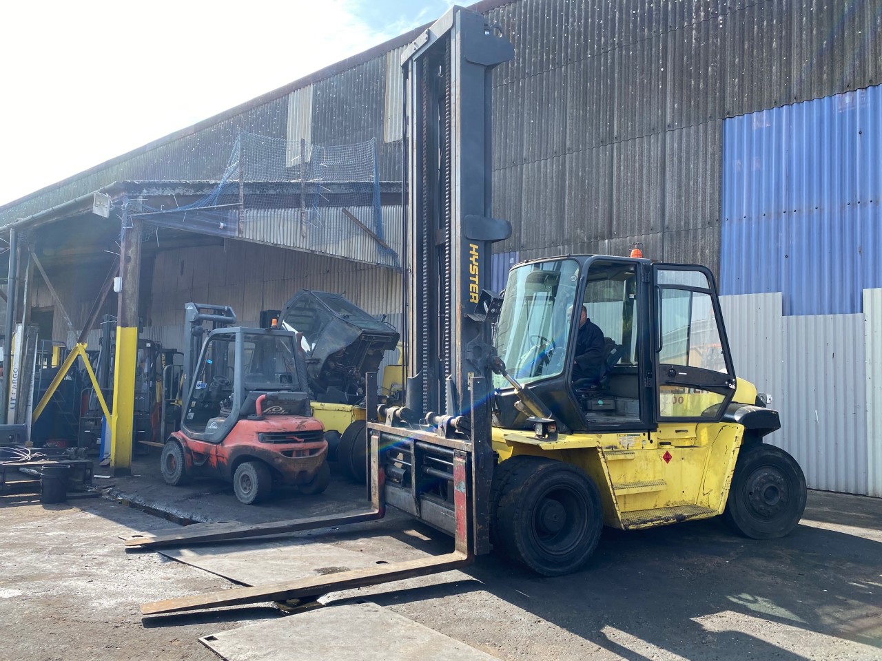 Industrial Heavy Duty Forklift Trucks and Container Handlers on behalf of Hire Company